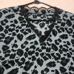 Dusty blue with black leopard spots, black lace neckline sleeveless blouse